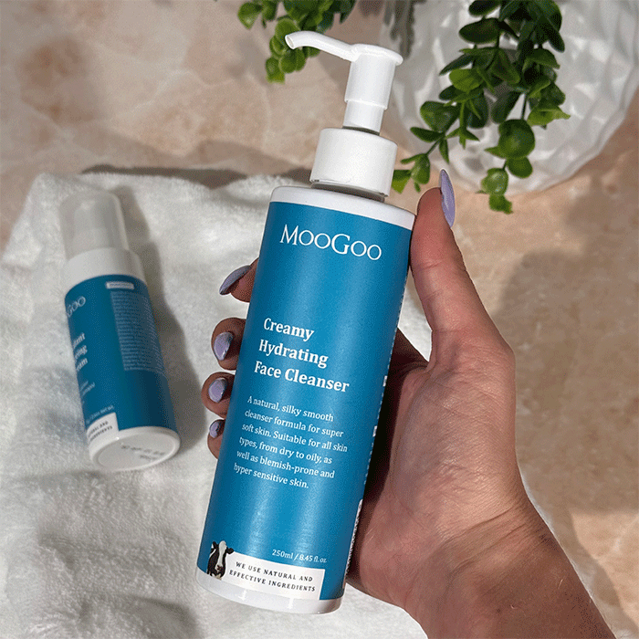 MooGoo Creamy Hydrating Face Cleanser in hand with clean bathroom aesthetic, soothing daily face wash for hydration and sensitive skin