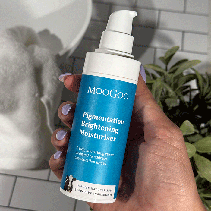 MooGoo Pigmentation Brightening Moisturiser shown in hand, nourishing cream to brighten skin tone and reduce pigmentation naturally