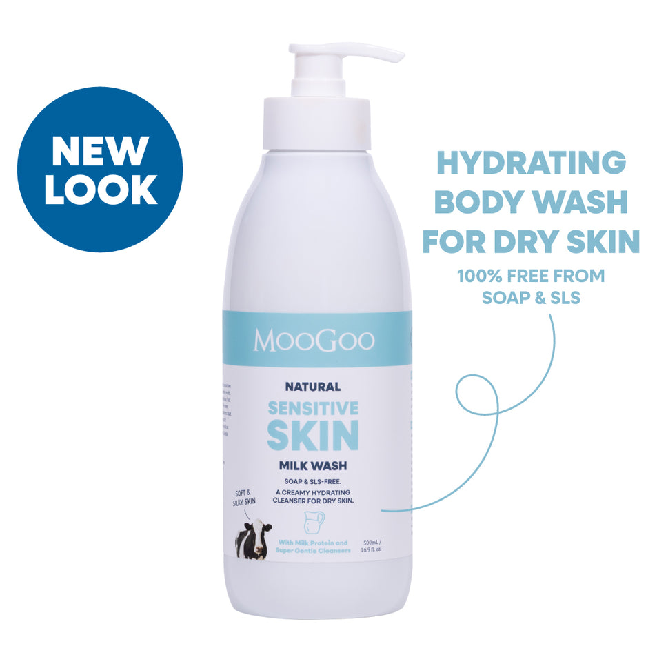 A bottle of MooGoo Natural Sensitive Skin Milk Wash with a pump dispenser, shown on a white background with text and a blue 'NEW LOOK' badge. Hydrating face and body wash with phthalate free fragrance for sensitive skin. 